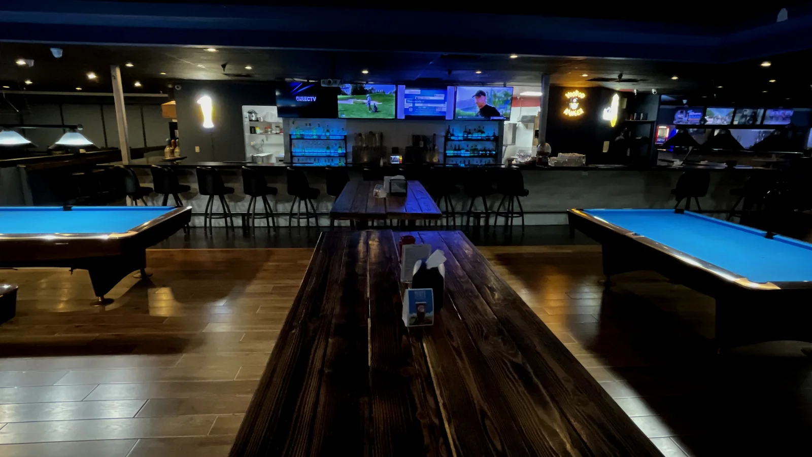 Actual lounge and game-room atmosphere at The Break Room, editorially graded from client-supplied photography