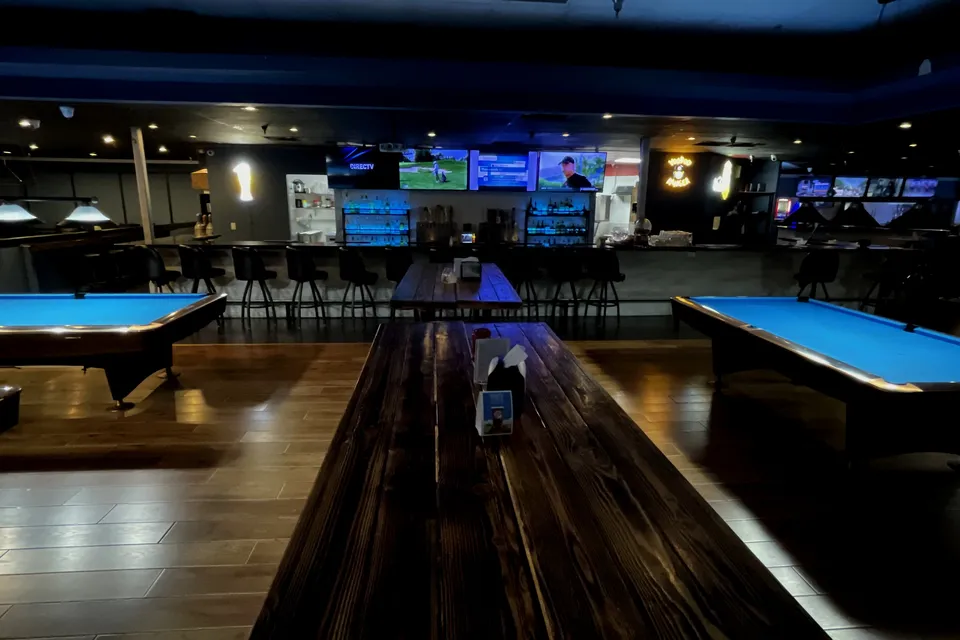 A communal table in the game room at The Break Room in Glendale