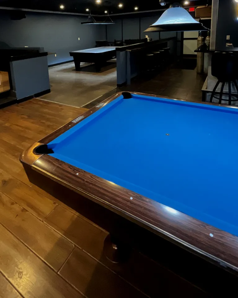 A lit pool table in The Break Room, Glendale